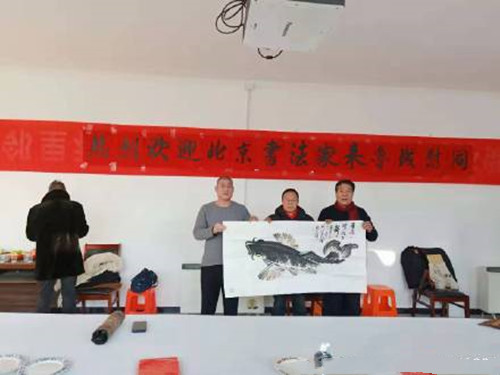 河北省采风学会北京分会组织书画家到鲁城村义写春联
